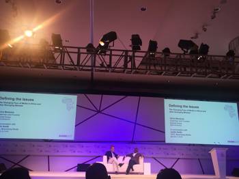 Two people sit and talk on stage as part of the 3rd Bloomberg Africa Business Media Innovators Forum